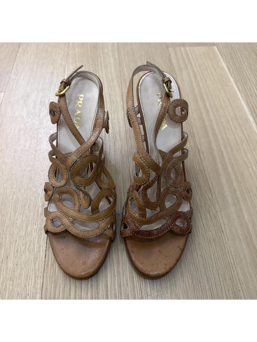 Prada brown leather sandals with circular cutouts